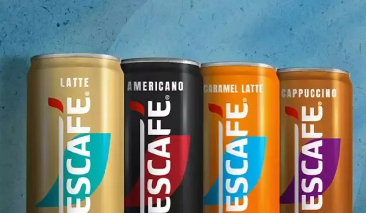 Banner Nescafé plechovky